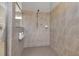Tiled shower features neutral tile and a modern shower head at 15607 White Linen Dr, Bradenton, FL 34211