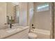Well-lit bathroom features a modern vanity, shower-tub combo, and a large mirror at 1919 Woodleaf Hammock Ct, Bradenton, FL 34211