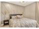 Comfortable bedroom featuring a stylish accent wall, modern lighting, and a well-coordinated color scheme at 1919 Woodleaf Hammock Ct, Bradenton, FL 34211