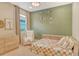 Inviting bedroom with a cozy bed, neutral dresser, and window with natural light at 1919 Woodleaf Hammock Ct, Bradenton, FL 34211
