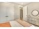 Bright bedroom with a plush throw, dresser, and mirror, offering a calm retreat at 1919 Woodleaf Hammock Ct, Bradenton, FL 34211