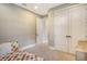 Comfortable bedroom with closet and doorway, featuring modern design at 1919 Woodleaf Hammock Ct, Bradenton, FL 34211