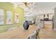 View from dining area showing an open layout to the kitchen and living room at 1919 Woodleaf Hammock Ct, Bradenton, FL 34211