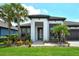 Charming one-story home with lush tropical landscaping and a welcoming entrance at 1919 Woodleaf Hammock Ct, Bradenton, FL 34211