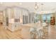 Bright kitchen featuring a central island with seating and stainless steel appliances at 1919 Woodleaf Hammock Ct, Bradenton, FL 34211