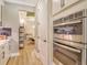 Close up of modern kitchen featuring stainless steel appliances and ample storage space at 1919 Woodleaf Hammock Ct, Bradenton, FL 34211