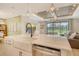 Spacious kitchen featuring a farmhouse sink and stainless steel dishwasher at 1919 Woodleaf Hammock Ct, Bradenton, FL 34211