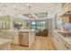 Open kitchen with views to living room and outdoor patio area at 1919 Woodleaf Hammock Ct, Bradenton, FL 34211