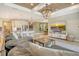 Open concept living room, kitchen, and dining area with modern decor and lots of light at 1919 Woodleaf Hammock Ct, Bradenton, FL 34211