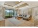 Comfortable living room featuring a large sectional sofa and sliding glass doors to the outside at 1919 Woodleaf Hammock Ct, Bradenton, FL 34211