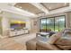 Bright living room with sliding glass doors and a large sectional sofa at 1919 Woodleaf Hammock Ct, Bradenton, FL 34211