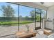 Covered patio with outdoor seating, wet bar, and a view of the backyard at 1919 Woodleaf Hammock Ct, Bradenton, FL 34211
