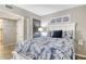 Inviting bedroom with natural light, soft bedding, and stylish decor at 2055 Gulf Of Mexico Dr # G2-108, Longboat Key, FL 34228