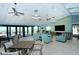 Community clubhouse with coastal decor, featuring ocean views and ample seating at 2055 Gulf Of Mexico Dr # G2-108, Longboat Key, FL 34228