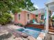 Charming backyard patio area with stylish blue outdoor rug and seating creates a cozy retreat at 2330 7Th W Ave, Bradenton, FL 34205
