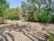 Expansive backyard featuring intricate brickwork design, lush greenery, and serene outdoor space at 2330 7Th W Ave, Bradenton, FL 34205