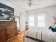 Bright bedroom with wood floors, large windows, and dresser with decorative mirror at 2330 7Th W Ave, Bradenton, FL 34205