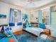 Whimsical bedroom featuring twin beds, blue accents, and plenty of natural light at 2330 7Th W Ave, Bradenton, FL 34205