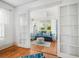 Bright living room featuring hardwood floors, a comfortable sofa and view of a sun room through french doors at 2330 7Th W Ave, Bradenton, FL 34205