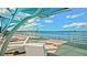 Peaceful waterfront walkway featuring modern seating with bridge and ocean views at 2330 7Th W Ave, Bradenton, FL 34205