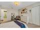 Bedroom with white decor, furniture and chandelier at 2332 Mizner Bay Ave, Bradenton, FL 34208