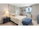 Bedroom featuring a nautical themed decor, natural lighting, and a blue ottoman at 2332 Mizner Bay Ave, Bradenton, FL 34208