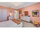 Bedroom featuring a white bed, decor, chandelier and view to other parts of house at 2332 Mizner Bay Ave, Bradenton, FL 34208