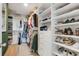 Organized walk-in closet with shelving and hanging space for clothes and shoes at 2332 Mizner Bay Ave, Bradenton, FL 34208