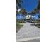 Impressive entrance to the community with palm trees and beautifully designed building at 2332 Mizner Bay Ave, Bradenton, FL 34208
