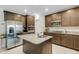 Modern kitchen featuring stainless steel appliances, granite countertops, and ample cabinet space at 2332 Mizner Bay Ave, Bradenton, FL 34208