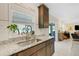 Bright kitchen featuring a stainless steel sink, granite countertops, and natural light at 2332 Mizner Bay Ave, Bradenton, FL 34208