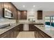 Well-equipped kitchen featuring stainless steel appliances, granite countertops, and ample storage at 2332 Mizner Bay Ave, Bradenton, FL 34208