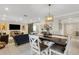 Open living room and dining area with comfortable seating, a decorative barn door, and stylish decor at 2332 Mizner Bay Ave, Bradenton, FL 34208