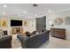 Comfortable living room featuring a decorative barn door and ample seating at 2332 Mizner Bay Ave, Bradenton, FL 34208