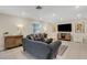 Comfortable living room featuring neutral tones, recessed lighting, and hardwood floors at 2332 Mizner Bay Ave, Bradenton, FL 34208
