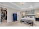 Well-lit main bedroom featuring a tray ceiling, soft carpet, and a large walk-in closet at 2332 Mizner Bay Ave, Bradenton, FL 34208