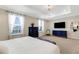 Bright main bedroom featuring a large bed, a tray ceiling, and ample natural light at 2332 Mizner Bay Ave, Bradenton, FL 34208