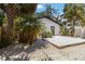 Landscaped backyard with a deck, plants and a well maintained exterior at 2410 Floyd St, Sarasota, FL 34239