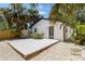 Charming backyard with a white deck and tropical landscaping providing a private outdoor space at 2410 Floyd St, Sarasota, FL 34239