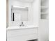 Modern bathroom featuring a floating vanity with double faucets and a large mirror at 2410 Floyd St, Sarasota, FL 34239