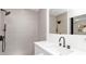 Stylish bathroom with a sleek shower, modern fixtures, and a floating vanity sink at 2410 Floyd St, Sarasota, FL 34239