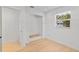 Bright bedroom with hardwood floors, walk-in closet, and window views at 2410 Floyd St, Sarasota, FL 34239