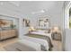 Comfortable bedroom with neutral decor, skylight, and bench at 2410 Floyd St, Sarasota, FL 34239