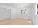 This bedroom offers a skylight to allow natural light in and gleaming hardwood floors at 2410 Floyd St, Sarasota, FL 34239