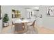 Bright breakfast nook features a marble table and modern white kitchen at 2410 Floyd St, Sarasota, FL 34239