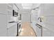 Bright, modern kitchen with sleek cabinetry and stainless steel appliances at 2410 Floyd St, Sarasota, FL 34239