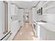 Sleek, modern kitchen featuring white cabinets and state-of-the-art appliances at 2410 Floyd St, Sarasota, FL 34239