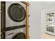 A convenient, stacked washer and dryer in a modern utility space at 2410 Floyd St, Sarasota, FL 34239