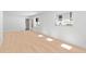 Bright room with wood flooring, white walls, and natural light coming through the windows at 2410 Floyd St, Sarasota, FL 34239