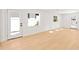Spacious room with light wood flooring and multiple entry points at 2410 Floyd St, Sarasota, FL 34239